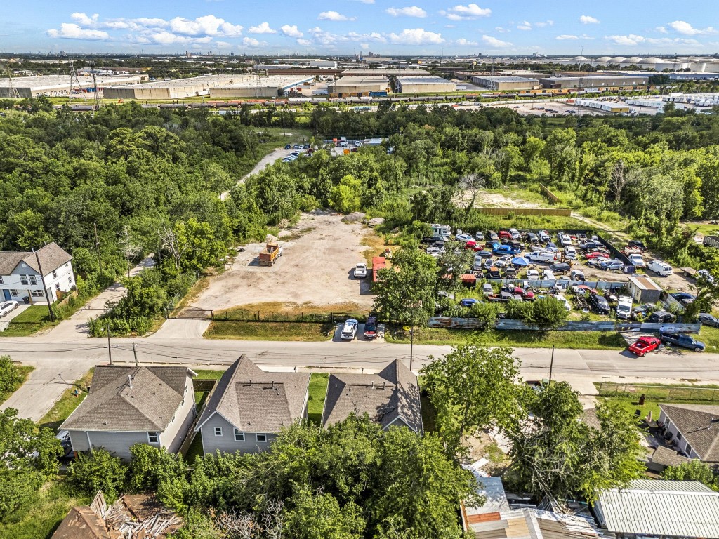 8357 Tate Street Houston, TX 77028 - Photo 39 of 40 an aerial view of a house with a garden and lake view