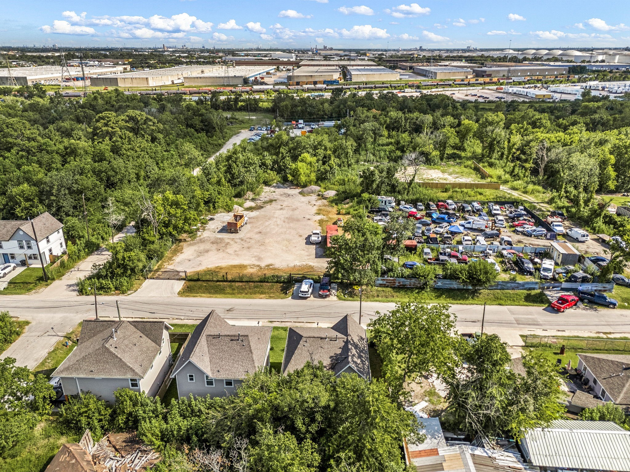 8357 Tate Street Houston, TX 77028 - Photo 41 of 42 an aerial view of a house with a garden and lake view