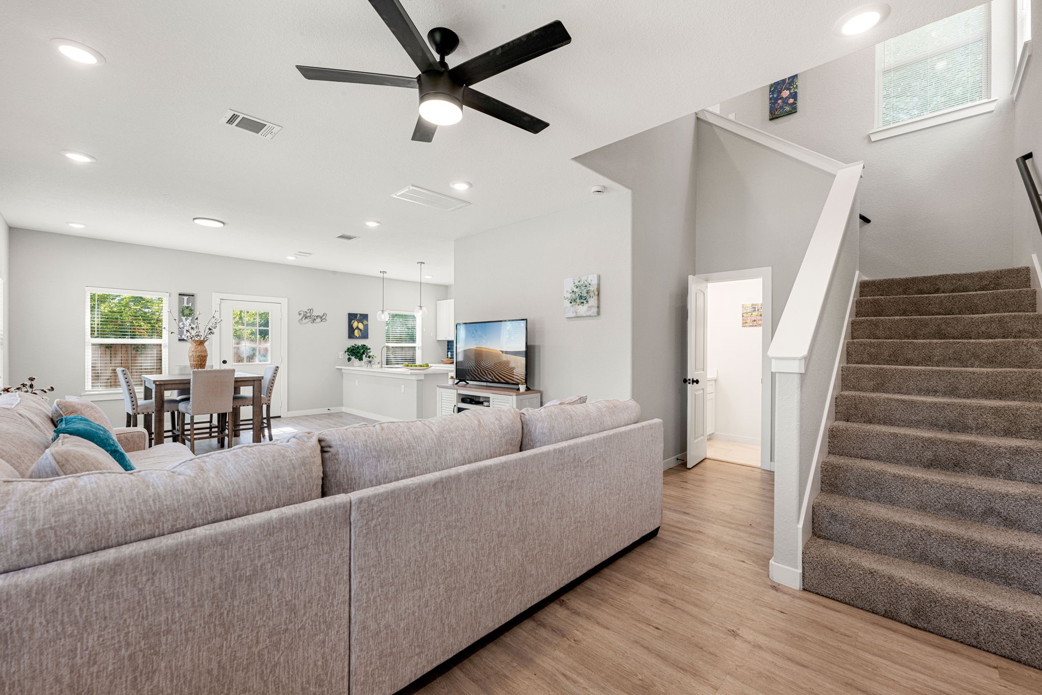 8357 Tate Street Houston, TX 77028 - Photo 8 of 42 a living room with furniture and a wooden floor
