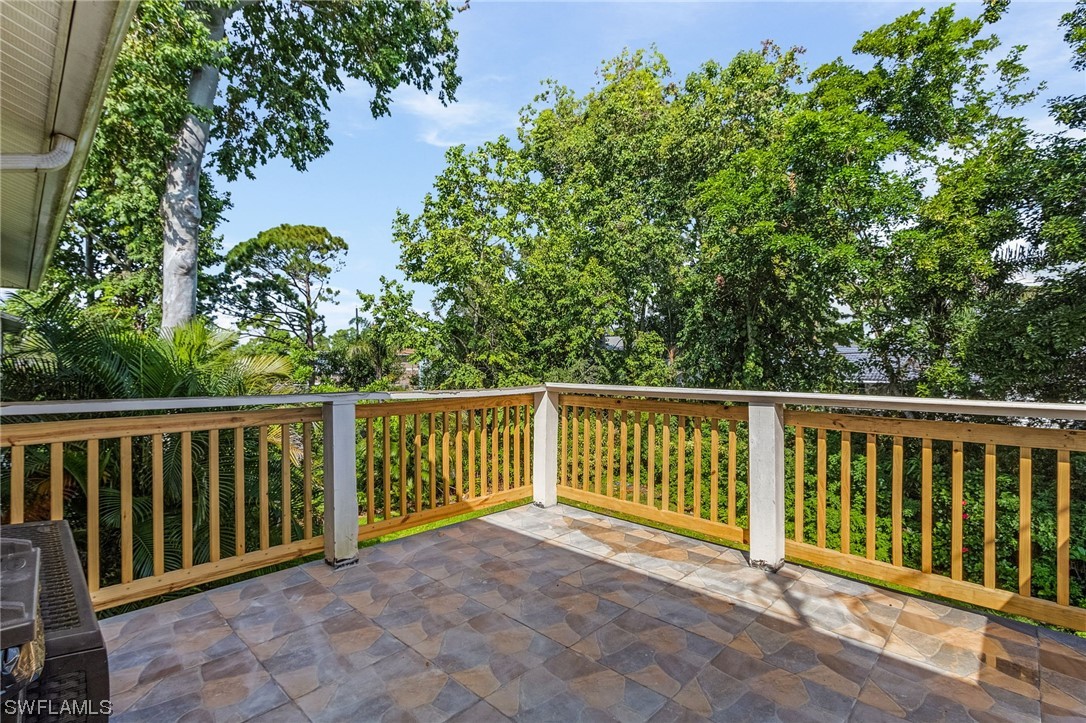 8185 Egret Road Fort Myers, FL 33967 - Photo 18 of 35 a view of a balcony with wooden floor