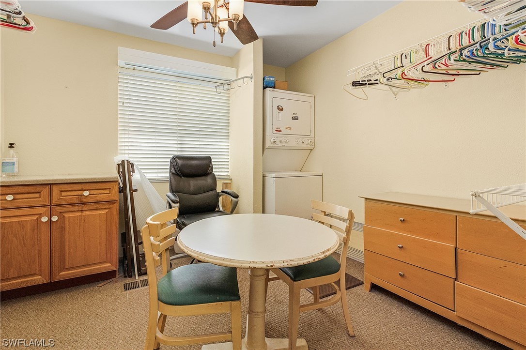 8185 Egret Road Fort Myers, FL 33967 - Photo 25 of 35 a bathroom with a sink a chair and dryer