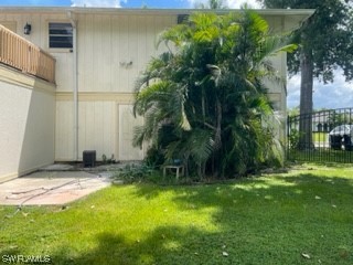 8185 Egret Road Fort Myers, FL 33967 - Photo 33 of 35 a view of yellow house with a yard