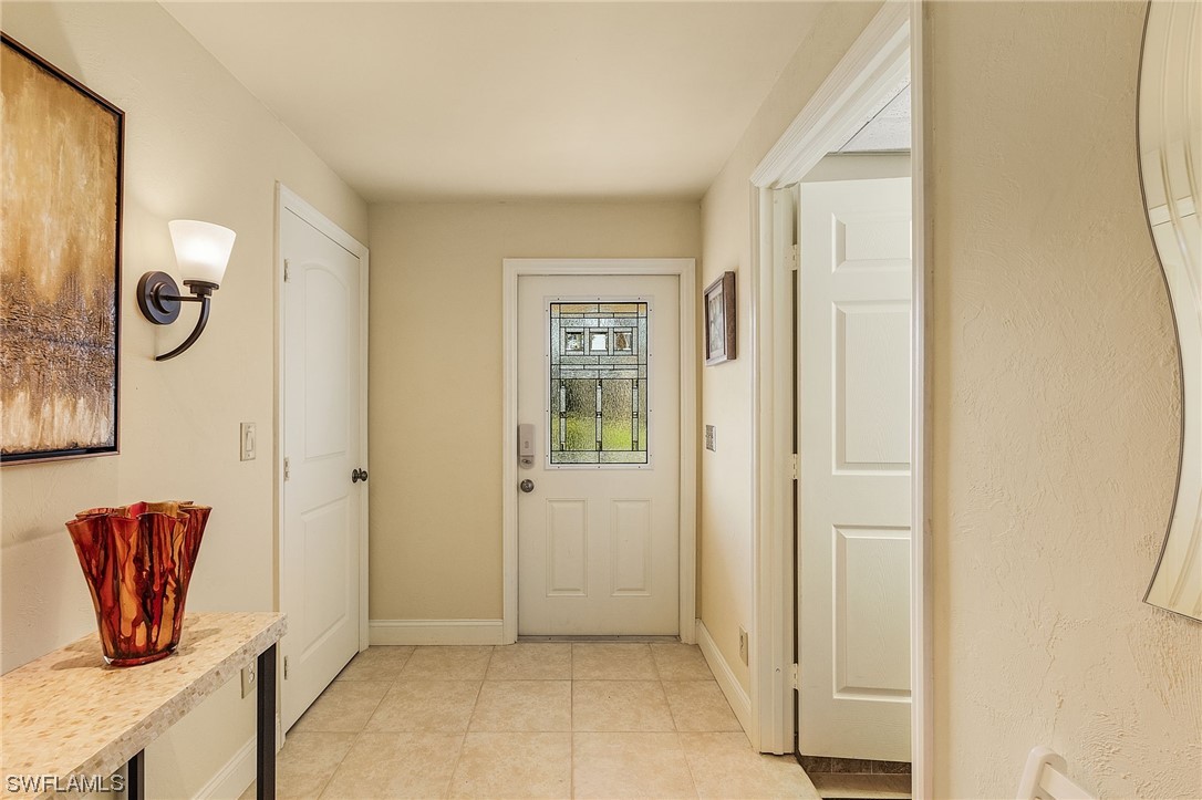 8185 Egret Road Fort Myers, FL 33967 - Photo 5 of 35 a view of an entryway with livingroom