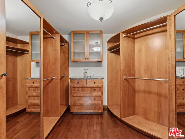 a bathroom with a shower and a glass door