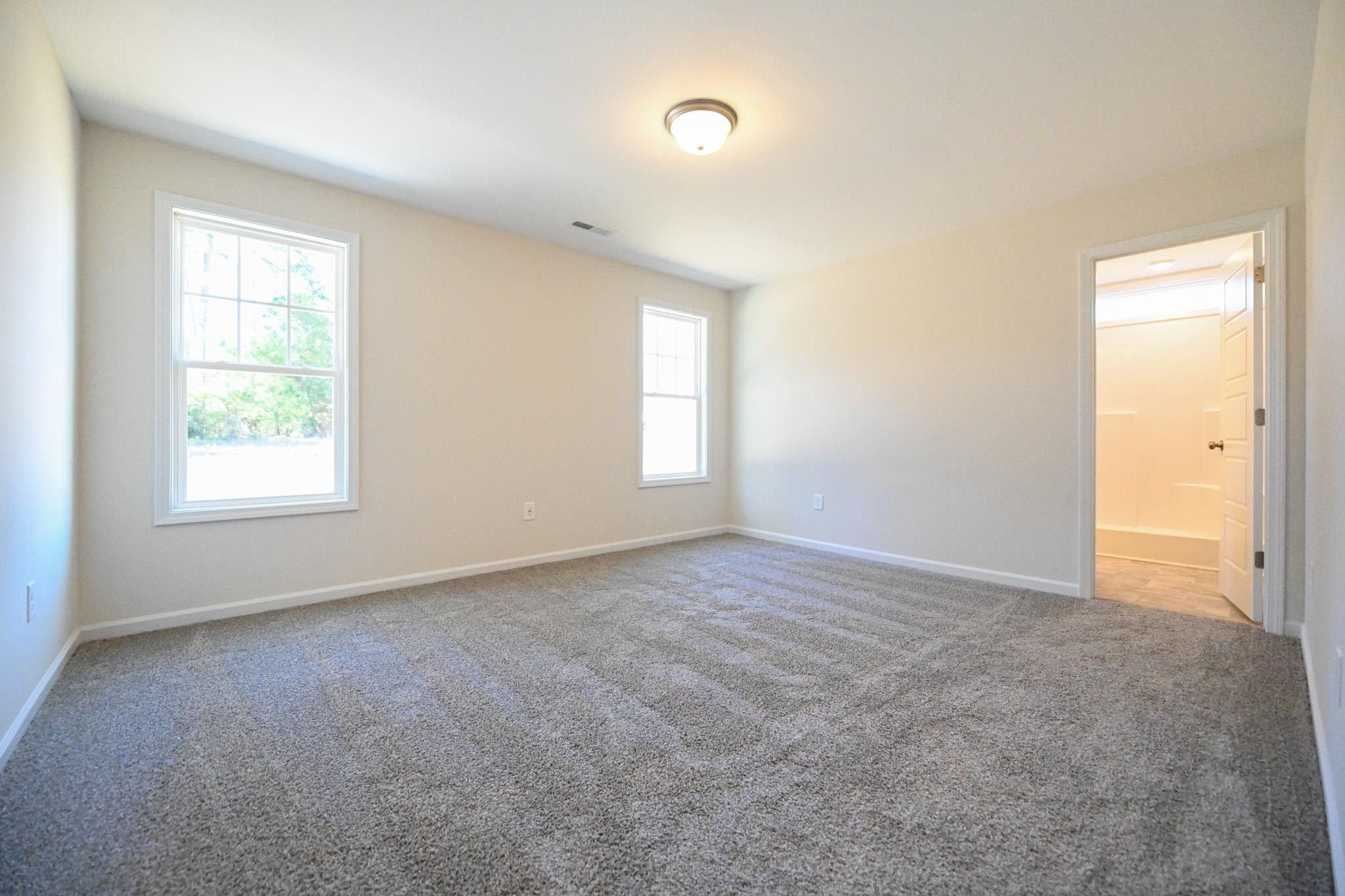 1701 Ramsdale Road Hope Mills, NC 28348 - Photo 14 of 25 an empty room with windows and closet