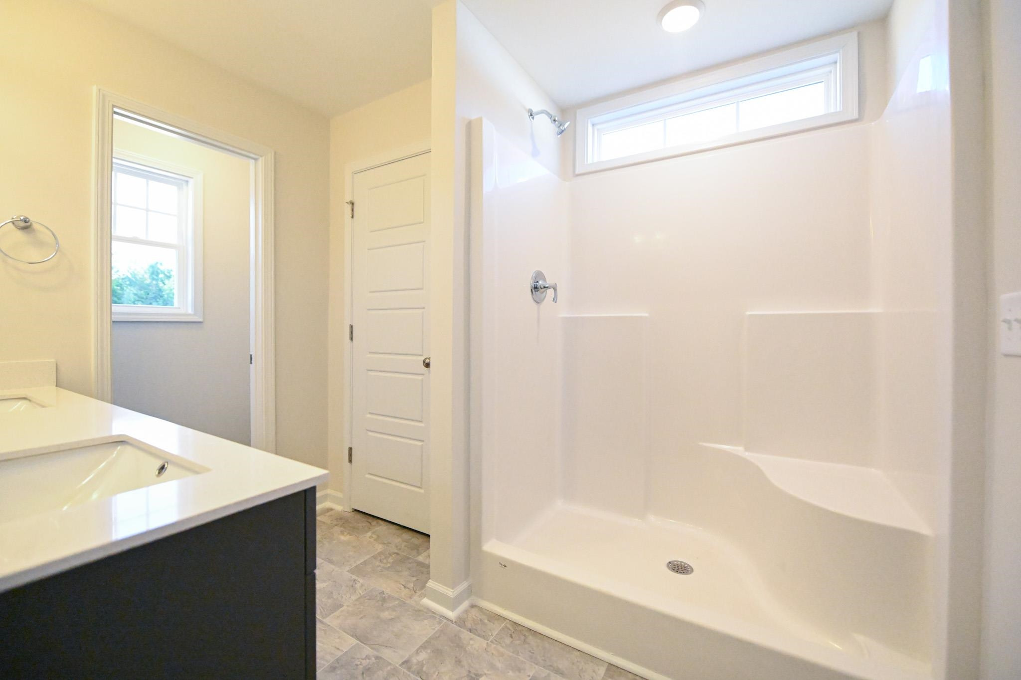 1701 Ramsdale Road Hope Mills, NC 28348 - Photo 17 of 25 a bathroom with a bathtub and a shower