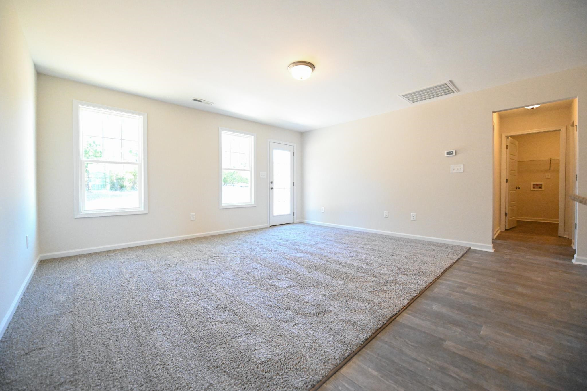 1701 Ramsdale Road Hope Mills, NC 28348 - Photo 6 of 25 an empty room with windows and closet
