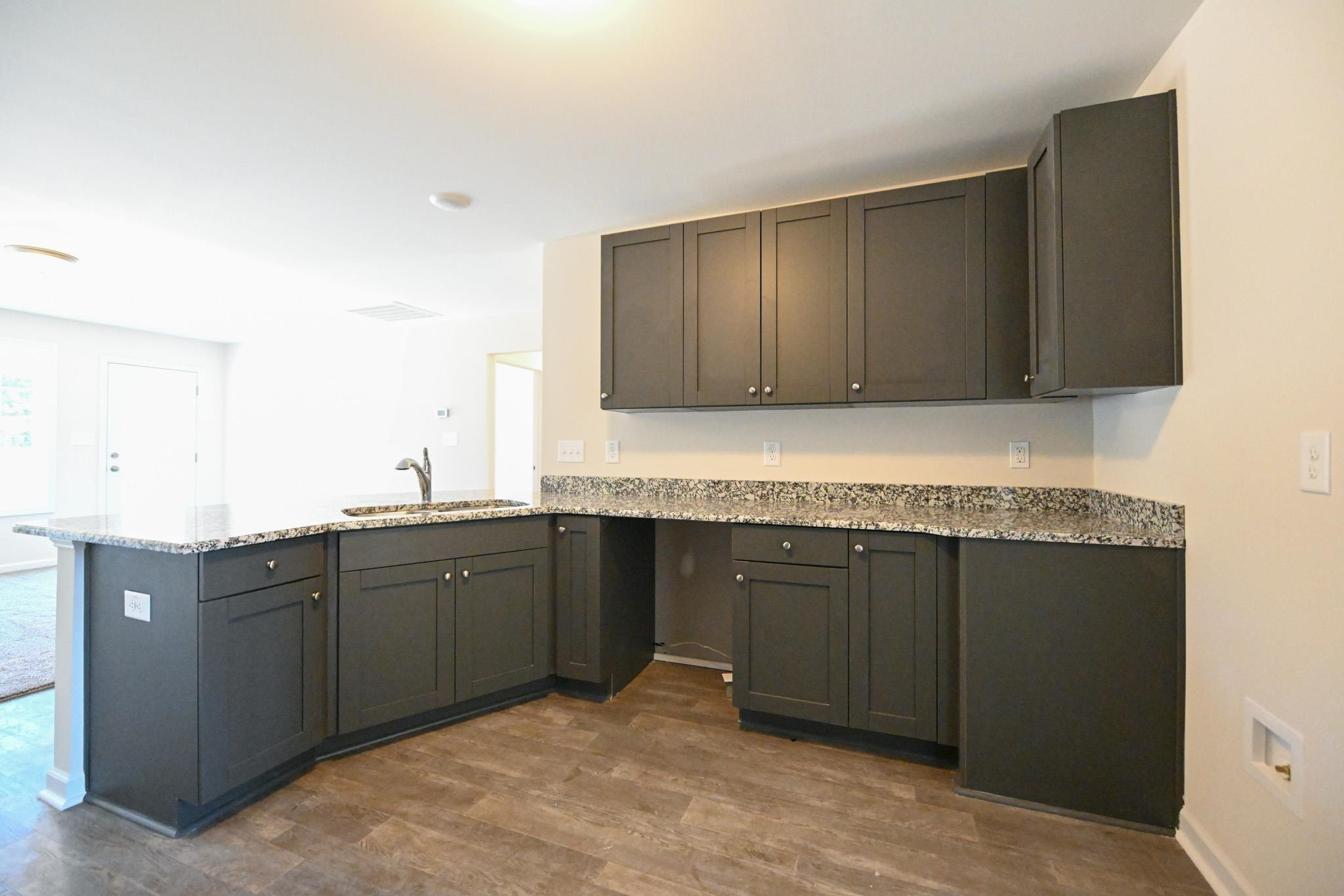 1701 Ramsdale Road Hope Mills, NC 28348 - Photo 10 of 25 a spacious bathroom with a granite countertop sink and a bathtub