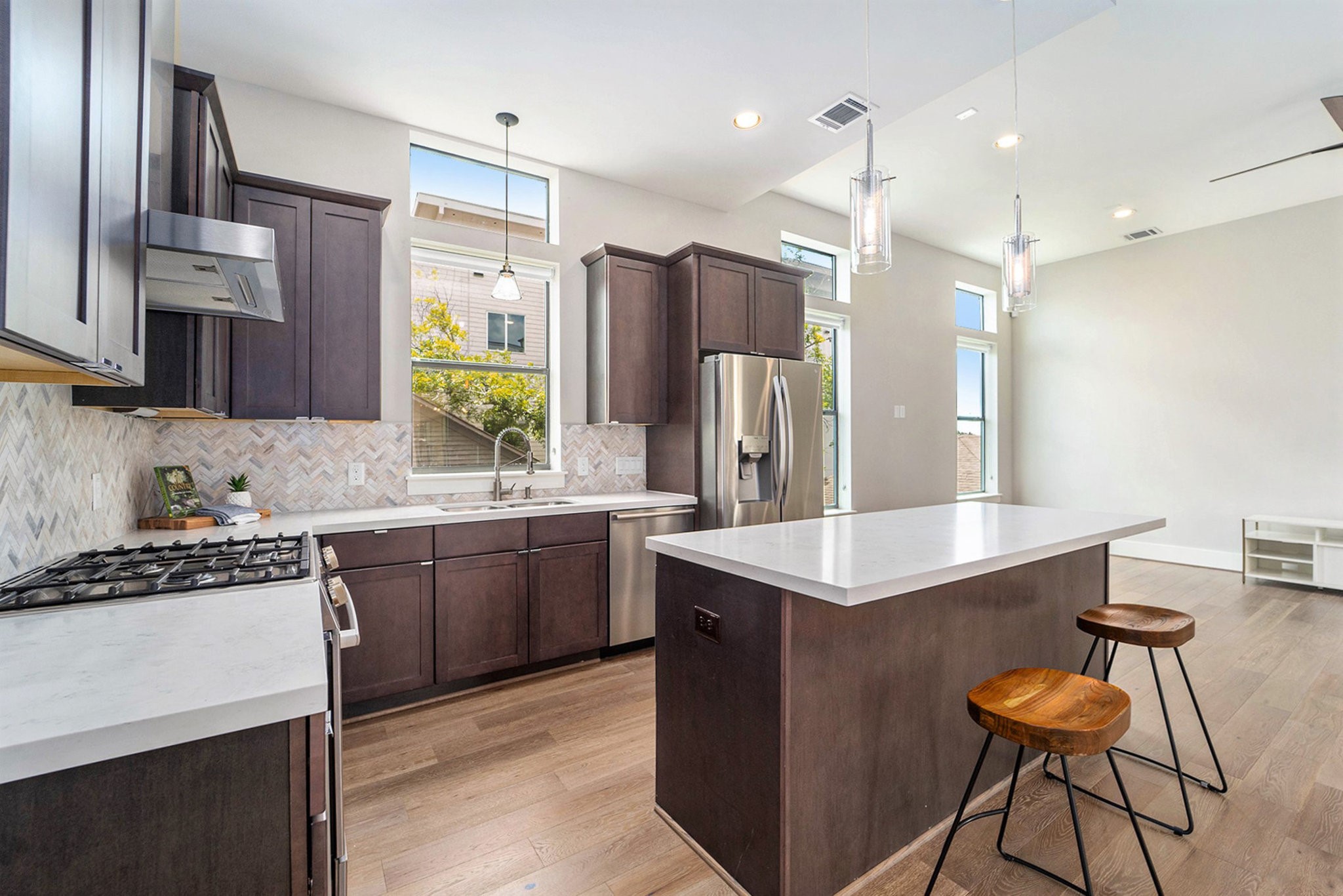 1507 Truxillo Street, Unit A Houston, TX 77004 - Photo 12 of 30 a kitchen with kitchen island granite countertop a sink stove and refrigerator