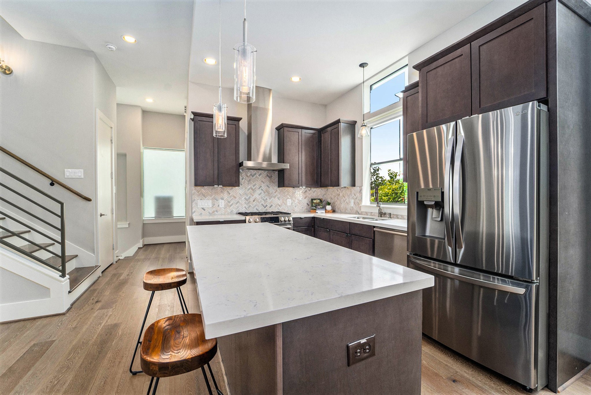 1507 Truxillo Street, Unit A Houston, TX 77004 - Photo 13 of 30 a kitchen with stainless steel appliances a refrigerator and a stove top oven
