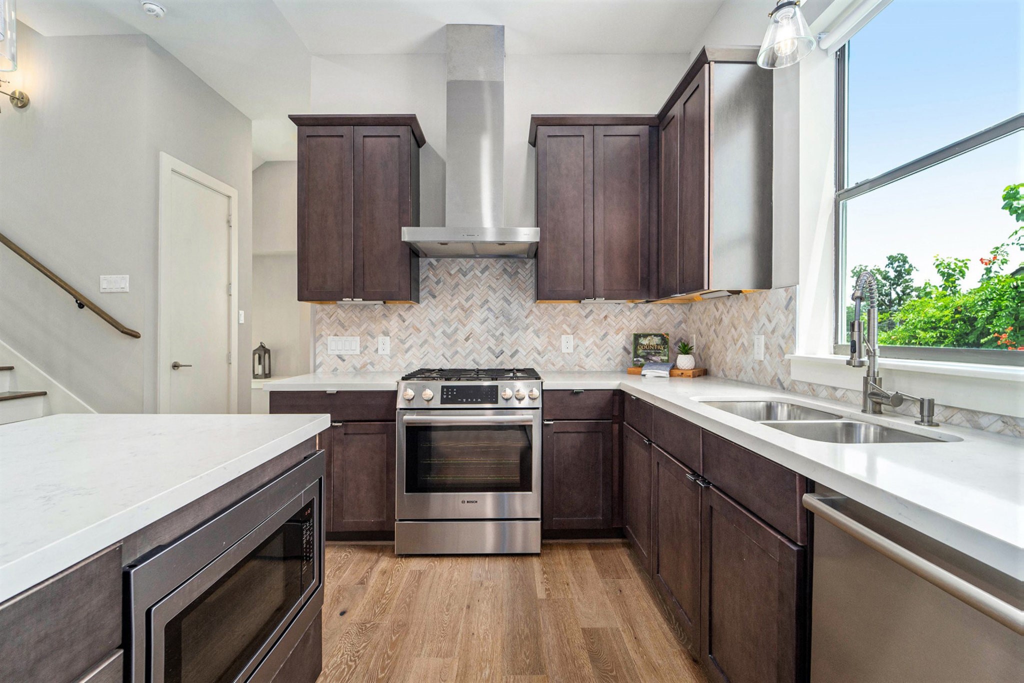 1507 Truxillo Street, Unit A Houston, TX 77004 - Photo 14 of 30 a kitchen with a sink stove and cabinets