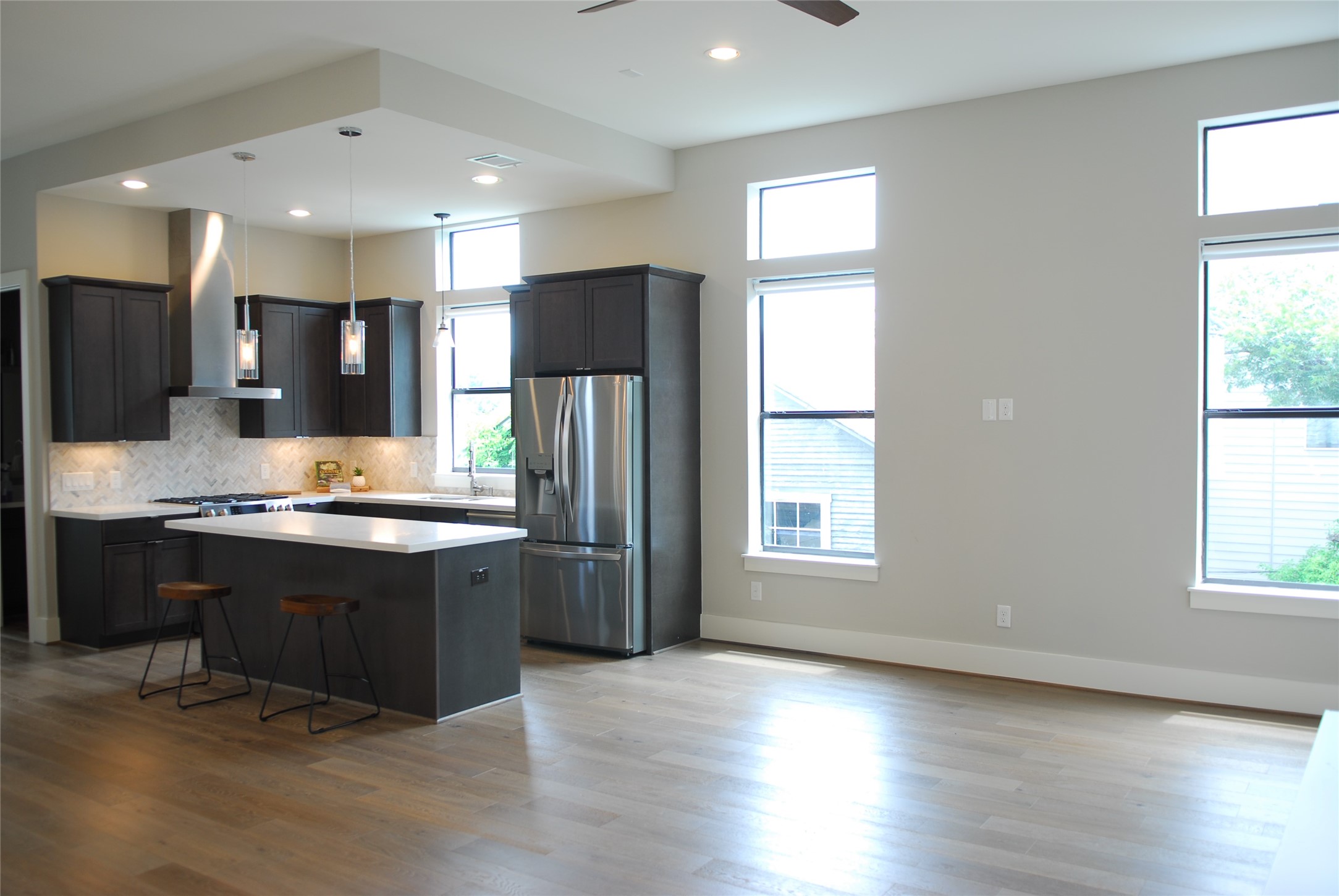1507 Truxillo Street, Unit A Houston, TX 77004 - Photo 16 of 30 a large kitchen with stainless steel appliances granite countertop a stove a sink and a refrigerator