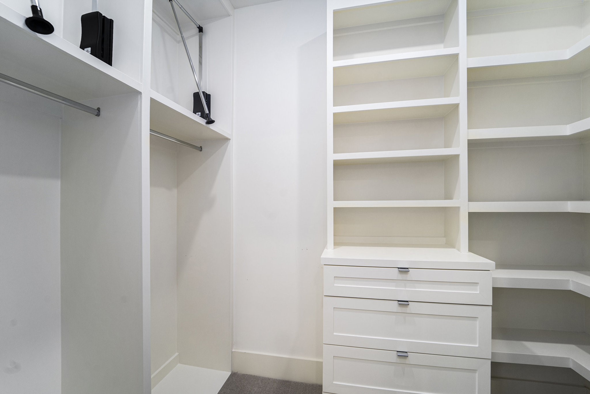1507 Truxillo Street, Unit A Houston, TX 77004 - Photo 27 of 30 a view of walk in closet with empty racks