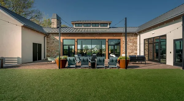 a outdoor living space with furniture and a potted plant