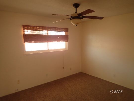 1144 West Boston Avenue Ridgecrest, CA 93555 - Photo 8 of 13 a view of a small space with a window