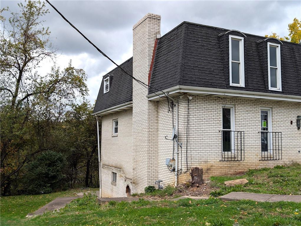 34 Walnut Avenue Dunbar, PA 15431 - Photo 2 of 13 front view of a house with a yard