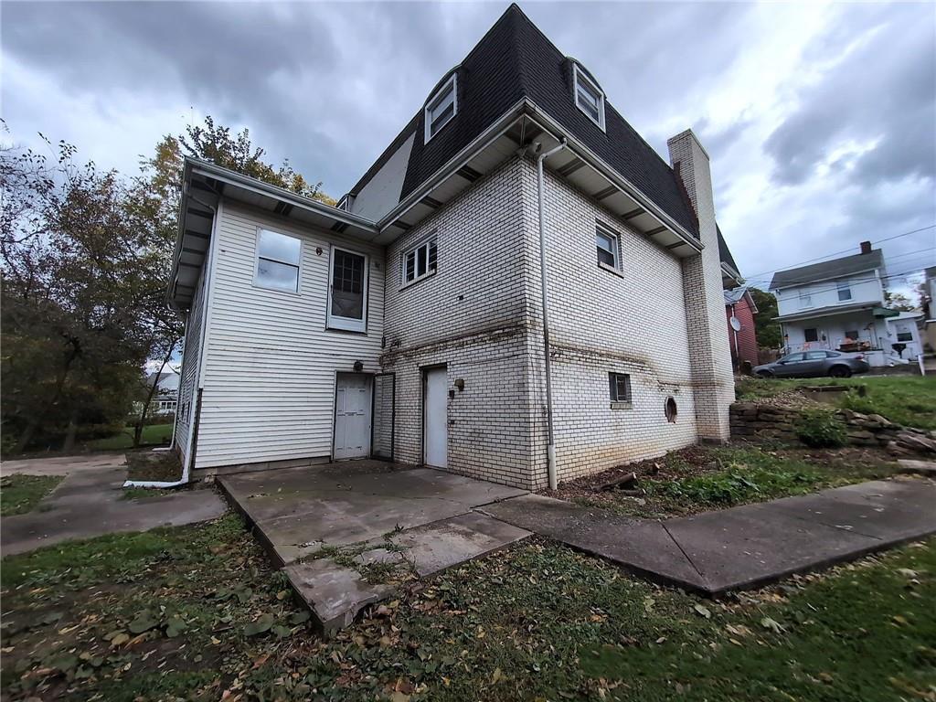 34 Walnut Avenue Dunbar, PA 15431 - Photo 3 of 13 a front view of a house with a yard