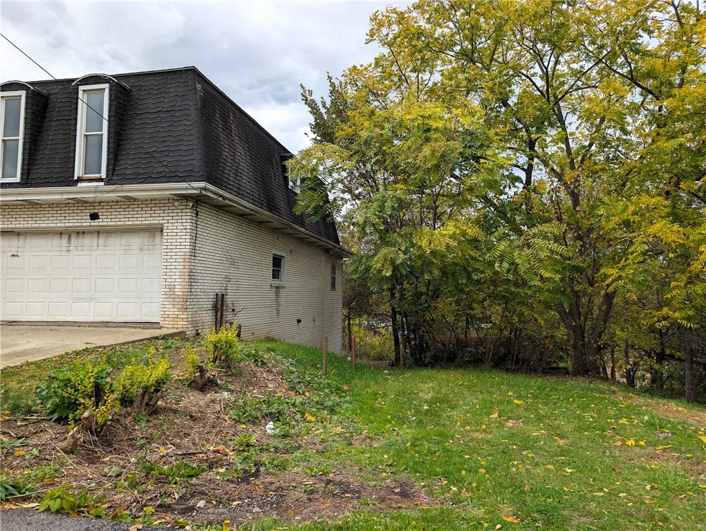 34 Walnut Avenue Dunbar, PA 15431 - Photo 4 of 13 a backyard of a house with lots of green space