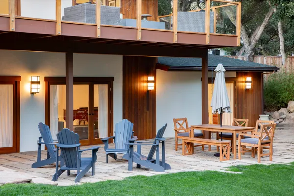 a view of a chairs and table in a patio
