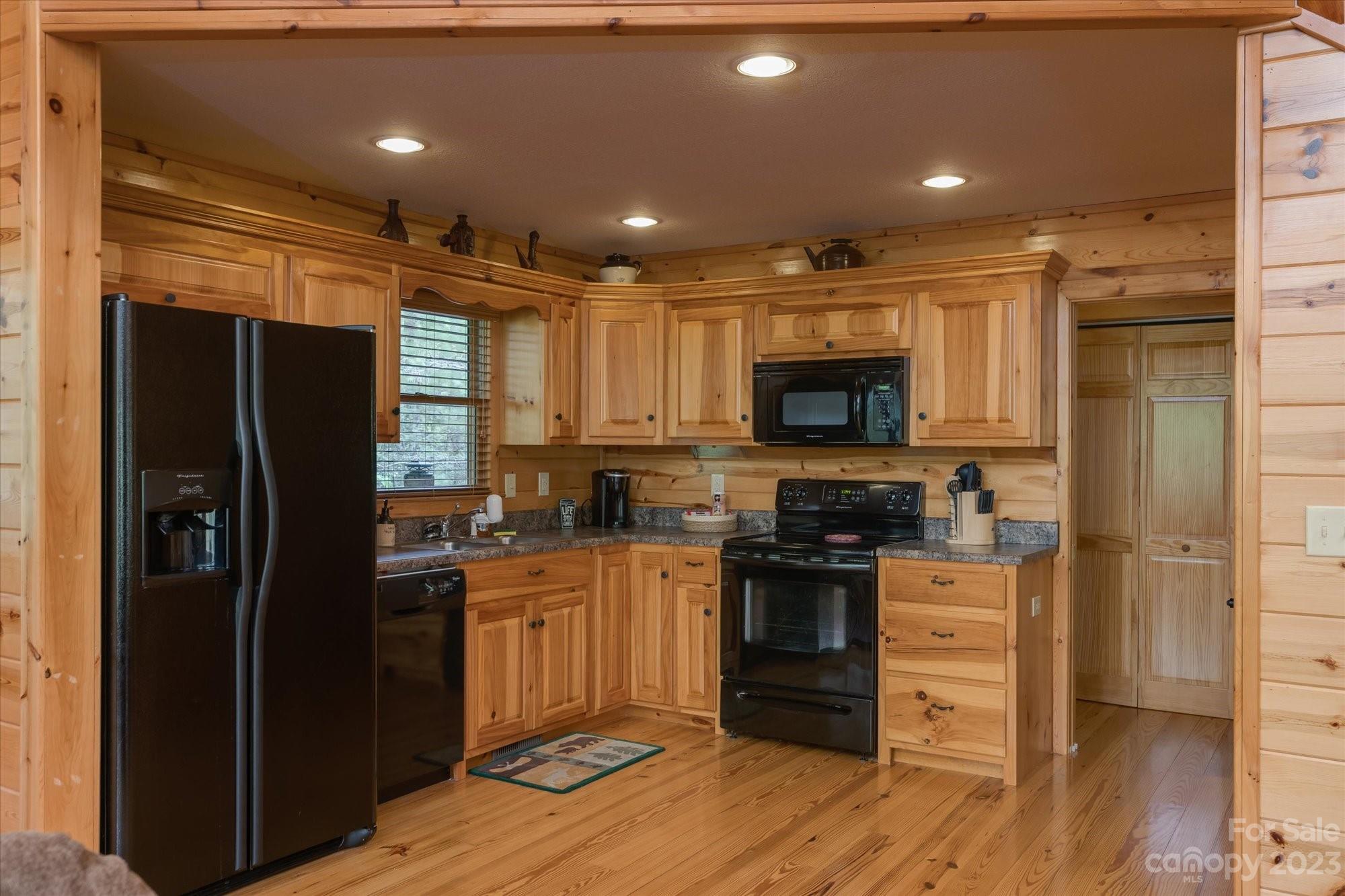 144 Camp David Road Murphy, NC 28906 - Photo 11 of 46 a kitchen with stainless steel appliances granite countertop a refrigerator and a stove top oven