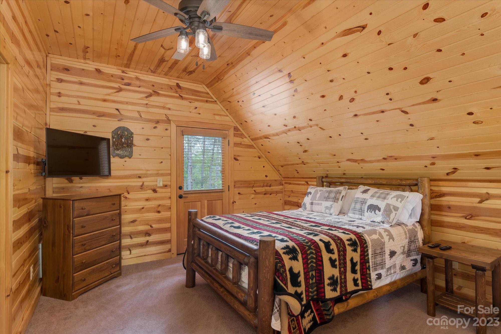 144 Camp David Road Murphy, NC 28906 - Photo 16 of 46 a bedroom with a bed and a flat screen tv