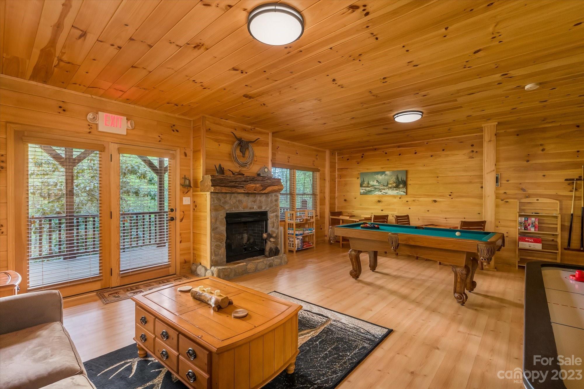 144 Camp David Road Murphy, NC 28906 - Photo 18 of 46 a living room with couch pool table and outdoor view