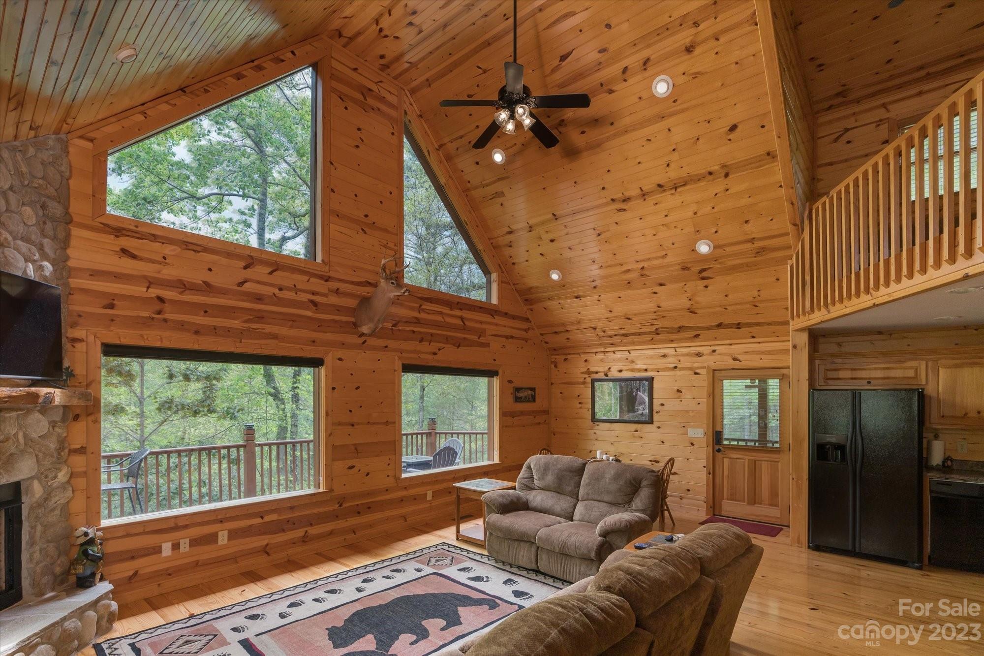 144 Camp David Road Murphy, NC 28906 - Photo 8 of 46 a living room with furniture and a floor to ceiling window