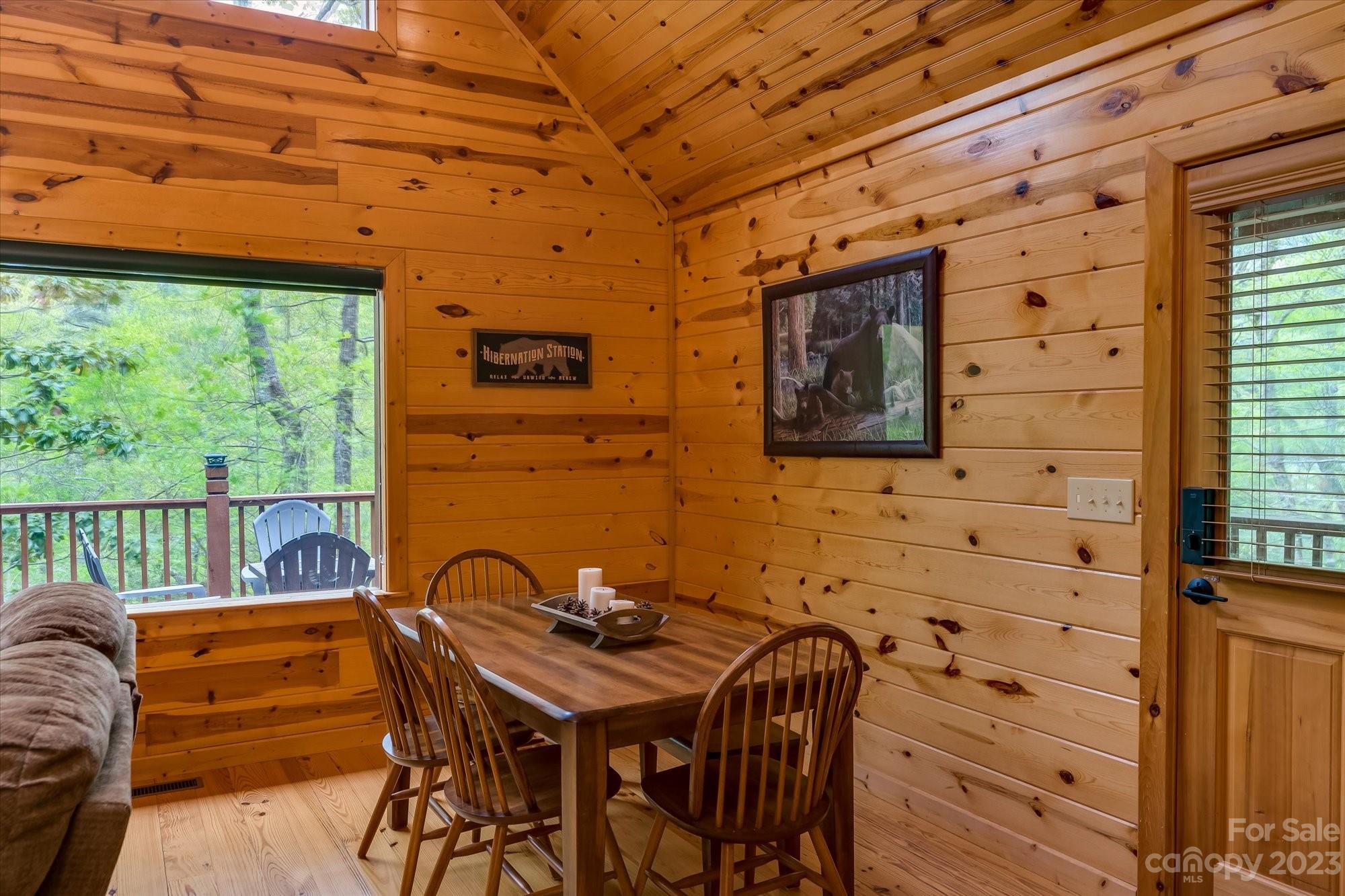 144 Camp David Road Murphy, NC 28906 - Photo 9 of 46 a view of a patio with table and chairs with wooden floor
