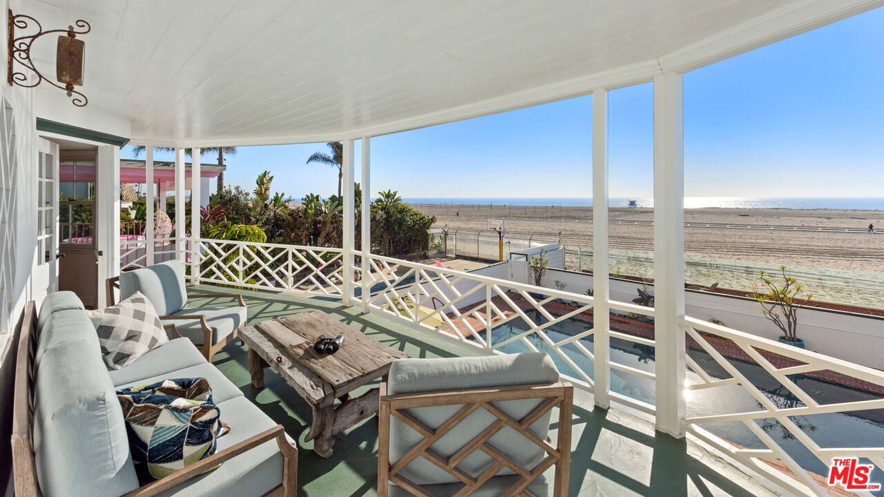 605 Palisades Beach Road Santa Monica, CA 90402 - Photo 26 of 33 a view of a patio with dining table and chairs