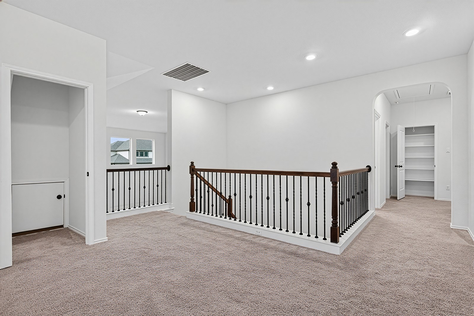 4600 Ercolano Lane Round Rock, TX 78665 - Photo 26 of 37 Spacious second-story landing featuring plush neutral-toned carpeting, white walls, and recessed lighting