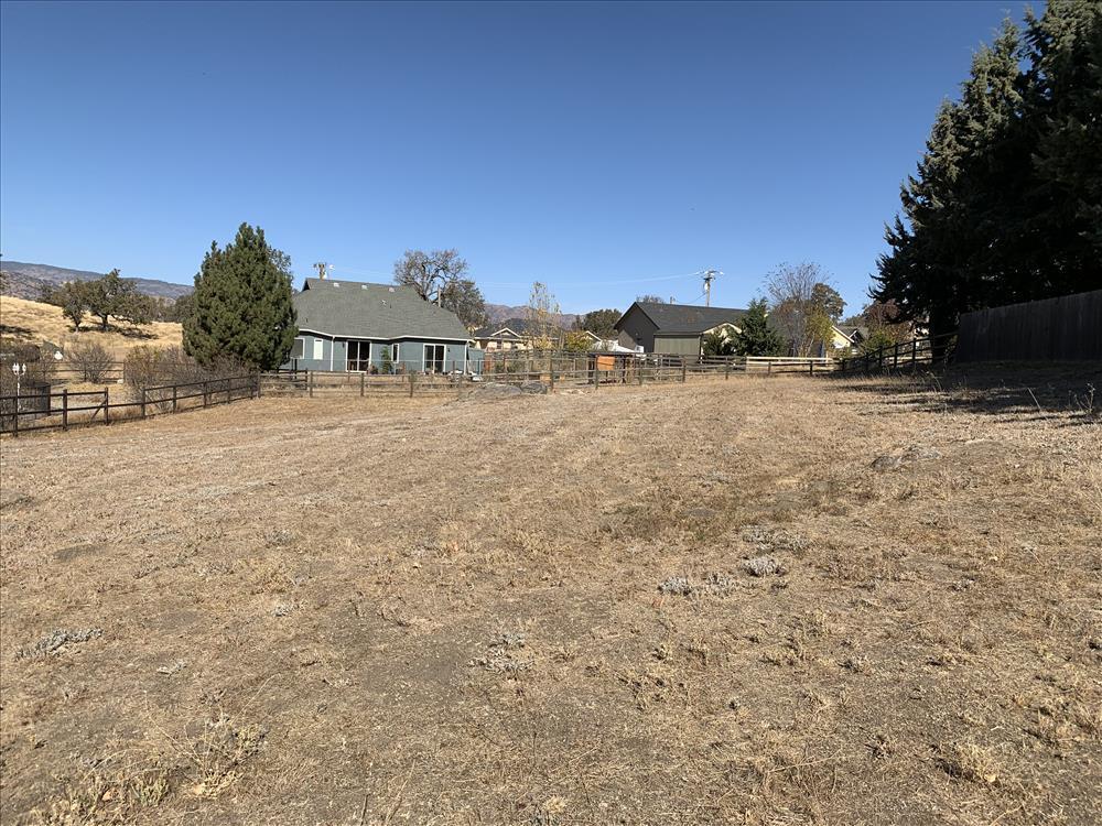 Arlington Place Tehachapi, CA 93561 - Photo 11 of 14 a view of a large house with a yard and large trees