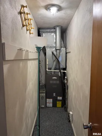a kitchen with a stove a sink and cabinets