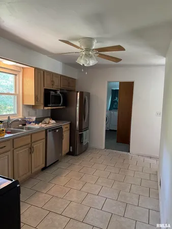 a living room with a fireplace and a fireplace