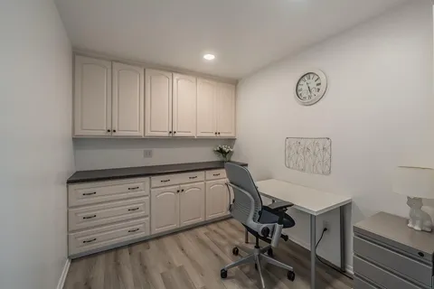 a view of workspace with wooden floor