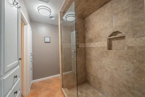 a bathroom with a shower and a sink