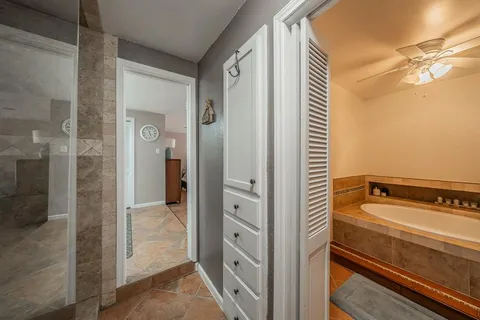 a bathroom with a tub and shower