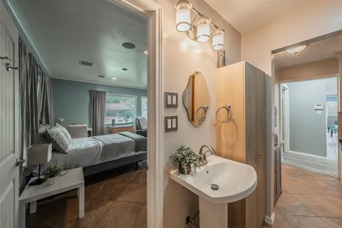 a bathroom with a sink and mirror