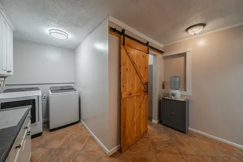 a view of a storage & utility room with washer and dryer