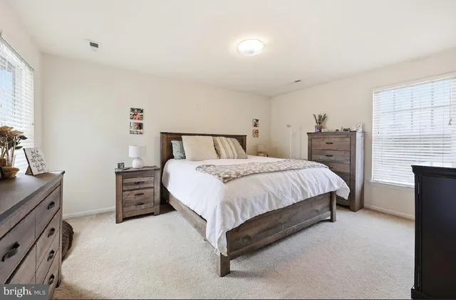 a bed room with a bed and a television