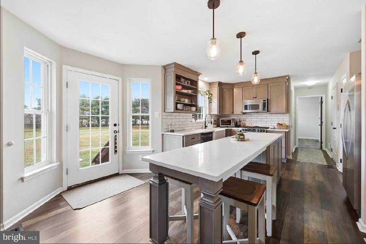 119 Basin Road Hammonton, NJ 08037 - Photo 9 of 29 a large kitchen with a table and chairs