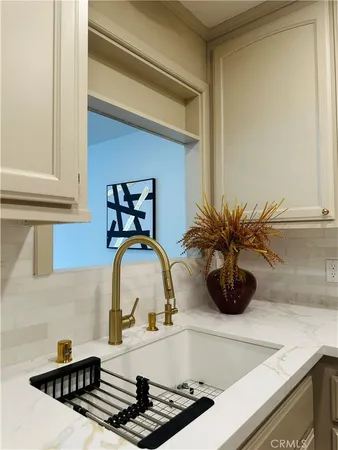 a kitchen with a sink and a stove