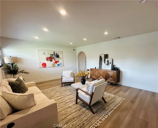 a living room with furniture and a window