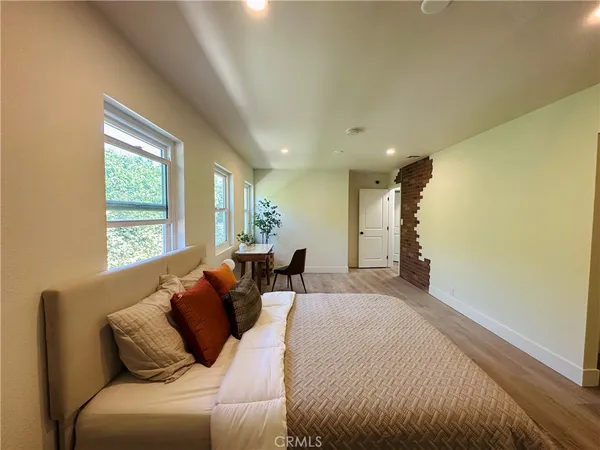 a bed room with a bed and a couch