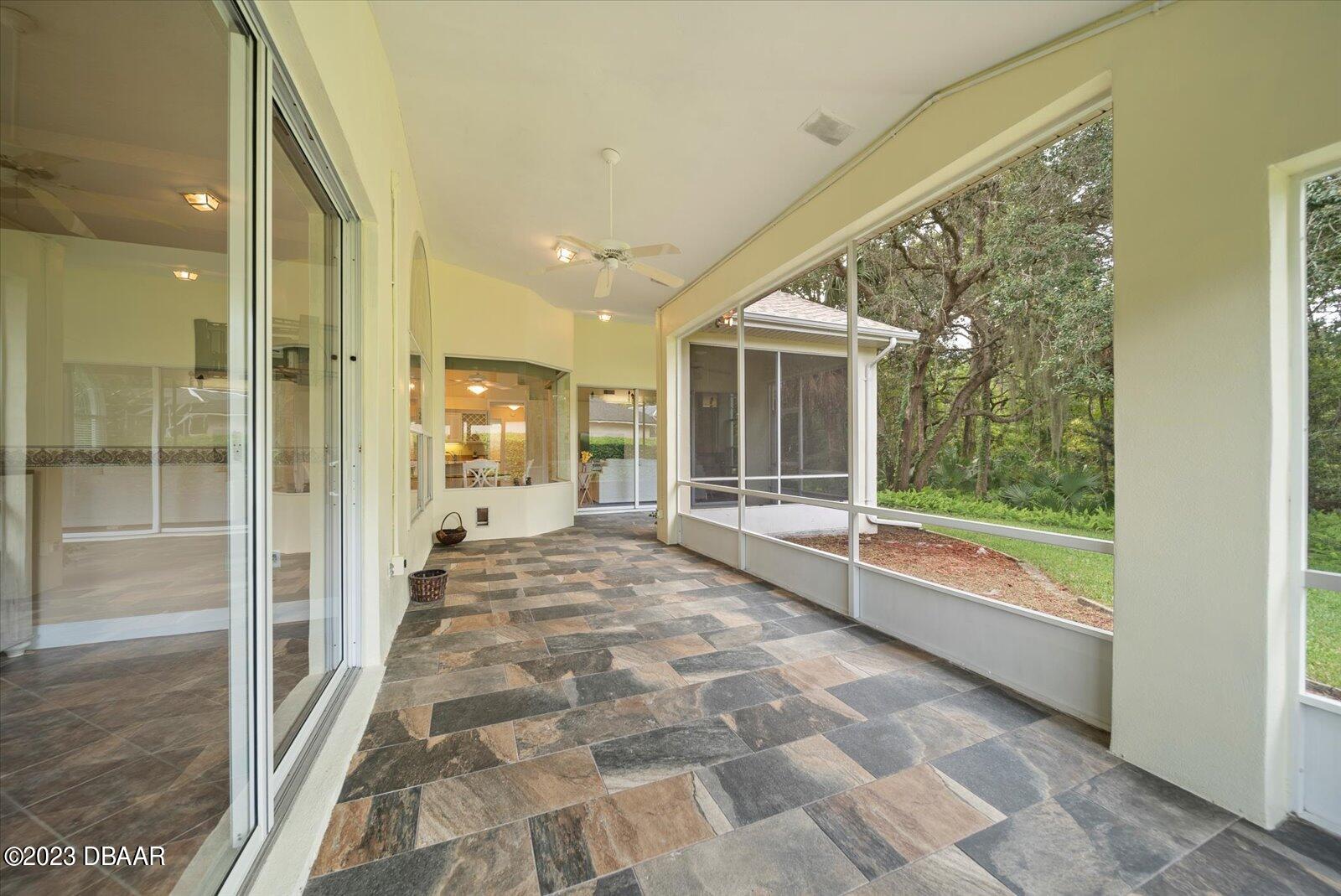 47 Coquina Ridge Way Ormond Beach, FL 32174 - Photo 36 of 51 Extra large wrap around screened lanai