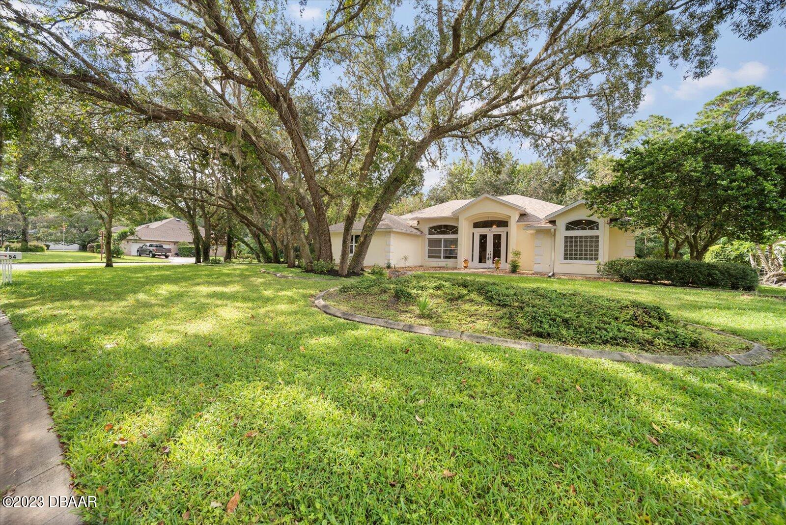 47 Coquina Ridge Way Ormond Beach, FL 32174 - Photo 5 of 51 Front of home from other corner.