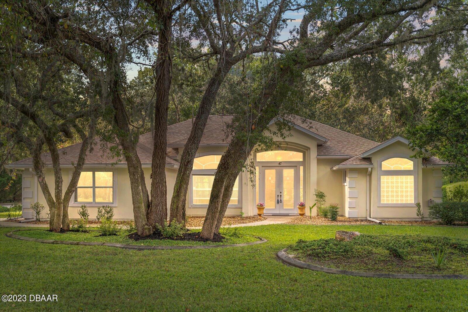 47 Coquina Ridge Way Ormond Beach, FL 32174 - Photo 7 of 51 Front of home - twighlight view