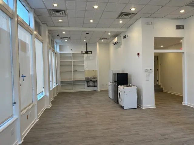 a bathroom with a glass door shower