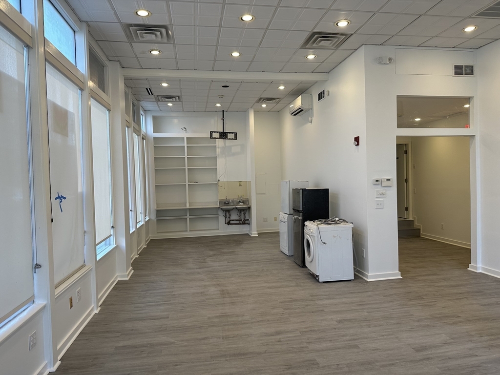 585 Massachusetts Avenue, Unit A Boston, MA 02118 - Photo 3 of 8 a bathroom with a glass door shower