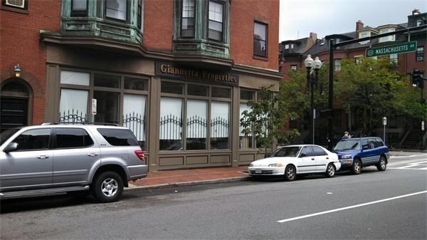 585 Massachusetts Avenue, Unit A Boston, MA 02118 - Photo 7 of 8 a view of a cars parked in front of a house