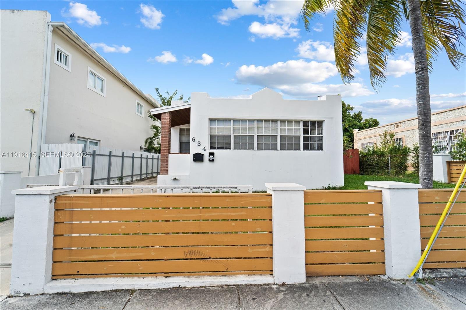 634 Southwest 10th Avenue Miami, FL 33130 - Photo 2 of 10 a view of a house with a wooden door